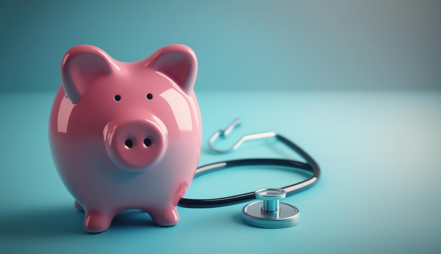 piggy bank and stethoscope